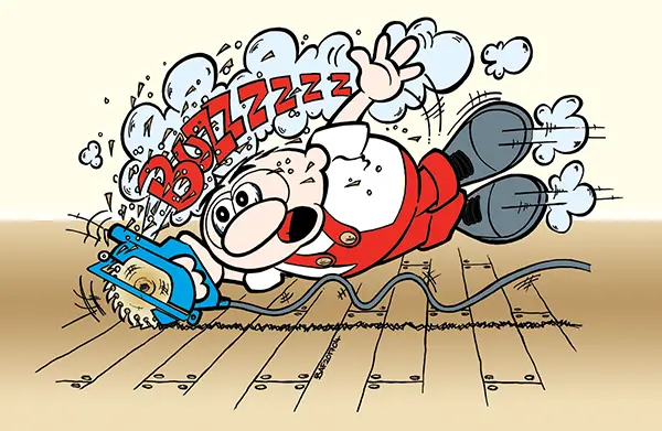 Plumber using power tools